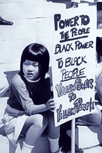 Part of an archival photograph of a rally to liberate Huey Newton in Oakland, California, 1969